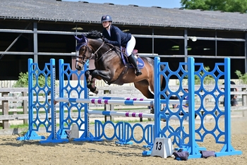 Scarlet Lilley speeds to an Equissage Pulse Senior British Novice Second Round win with Plot Cruise at Parwood Equestrian Centre